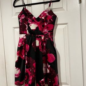 Jump Apparel floral on black spaghetti strap cocktail dress.